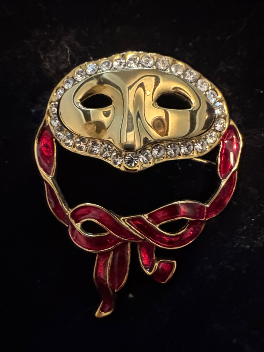 Vintage rare Gold Mask Brooch with Red Enamel Ribbon and Clear Crystals